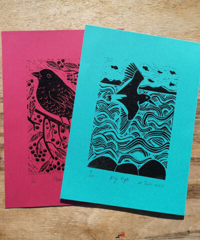 Pair of linocuts. Abundance and Fly High, coloured papers