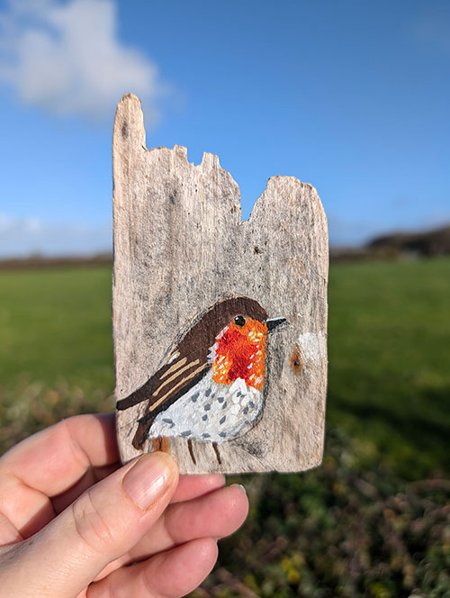 Gwen the Robin. Miniature painting on Welsh driftwood