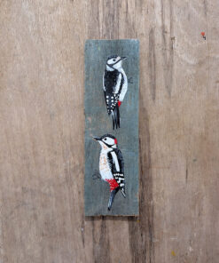 Alternative view of Ying and Yang. A pair of woodpeckers painted on The Isle of Colonsay wood