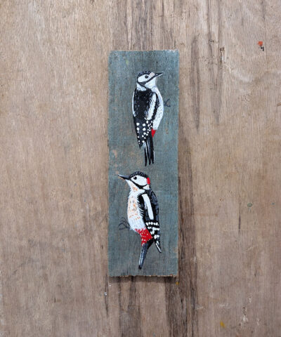 Alternative view of Ying and Yang. A pair of woodpeckers painted on The Isle of Colonsay wood